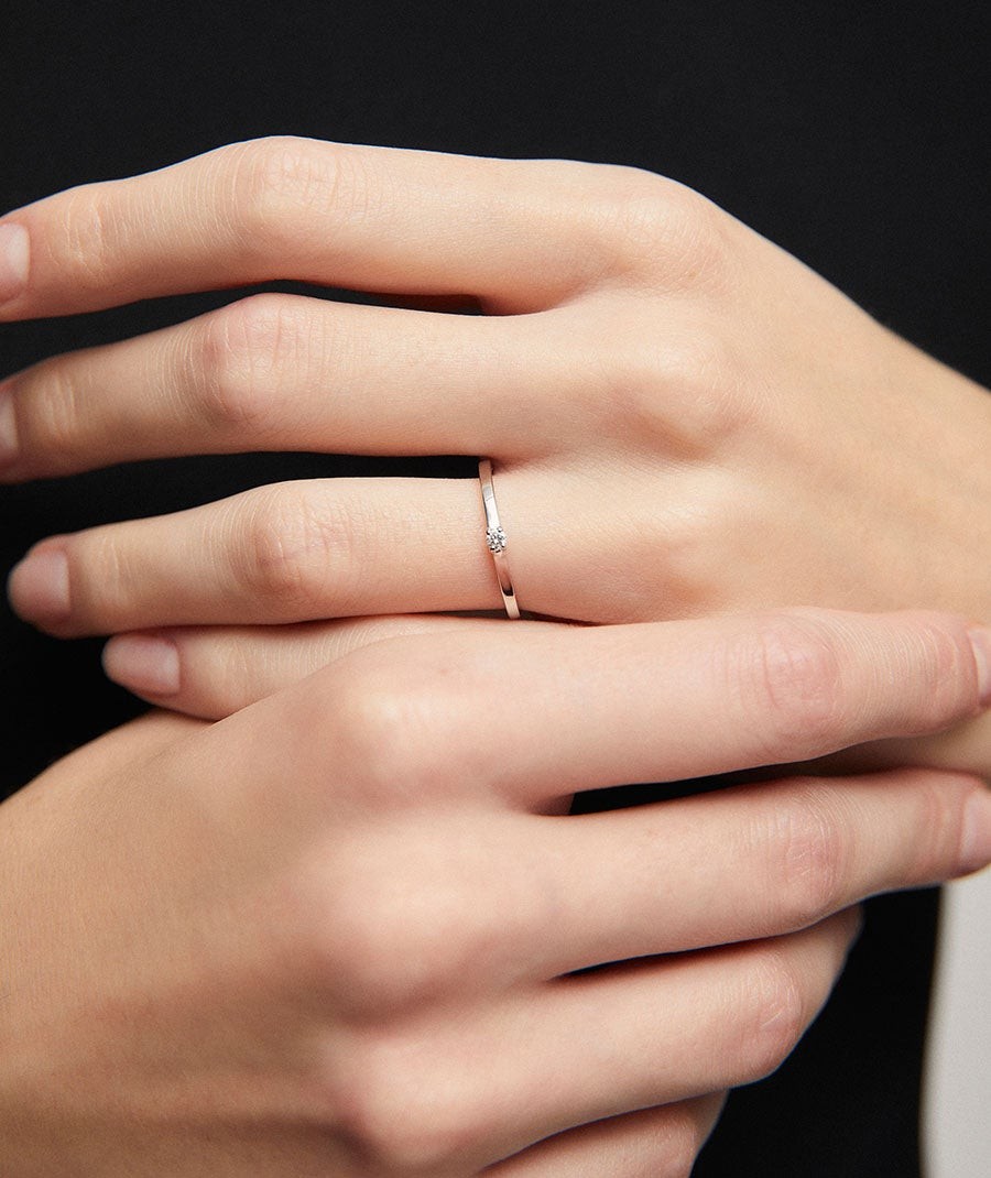 White gold ring with a single diamond